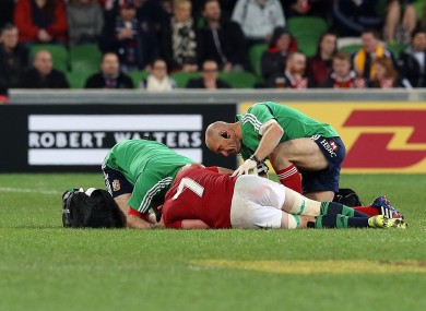 Dr Eanna Falvey and Physio Phil Pask treat Sean O'Brien on the 2013 Lions Tour.