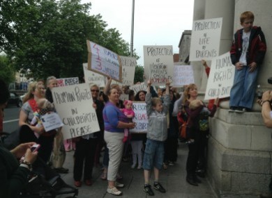Supporters outside the High Court last month