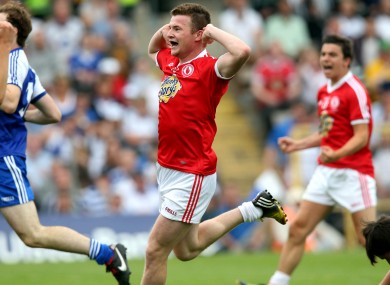 Ruairi McGlone taunts the Monaghan supporters after scoring a goal.