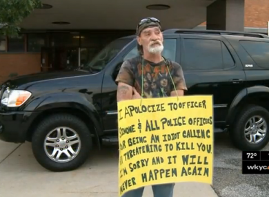 Richard Dameron holding his sign.