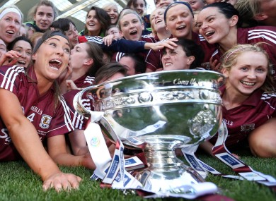 Galway players celebrate with the O'Duffy cup after the game.