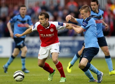 Pat's striker Christy Fagan and Barry McCabe of UCD.