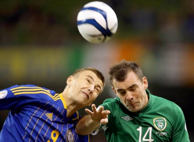 Darron Gibson challenges Alexey Chshyotkin: the Everton man was stretchered off in the first half with a nasty knee injury.