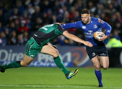 Fergus McFadden of Leinster fends off Connacht's Craig Ronaldson.