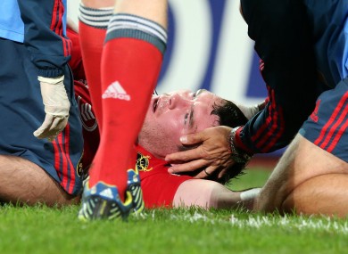 Peter O'Mahony is assessed by Munster medics after taking a heavy blow.