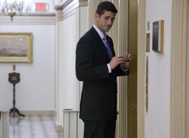 Paul Ryan looks at the gathered media as he waits to get on the lift to John Boehner's office last night.