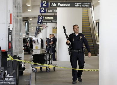 Police stand guard in Terminal 2 at Los Angeles International Airport